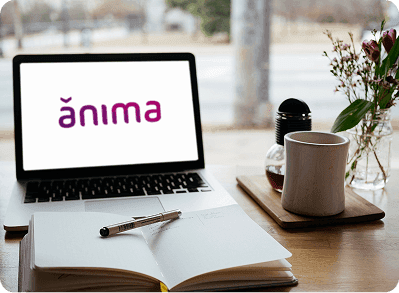 imagem de um notebook com a logo da ânima no fundo de tela