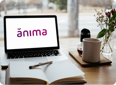 imagem de um notebook com a logo da ânima no fundo de tela